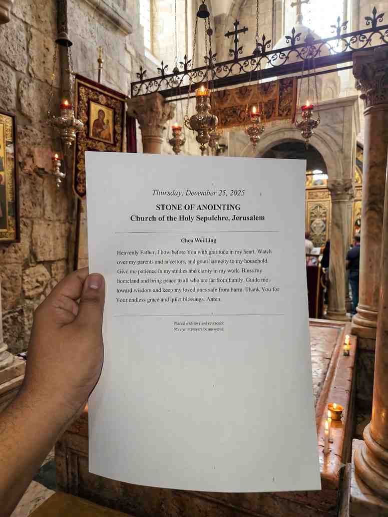 Photo confirmation of a prayer placed at the Stone of Anointing